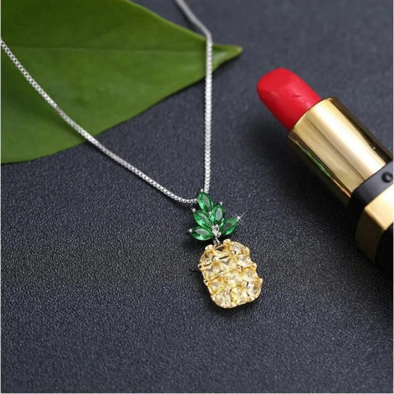Silver-plated geometric pineapple pendant necklace on model
