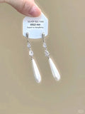 Geometric star and tassel design ear clips with rhinestone and heart details for women.