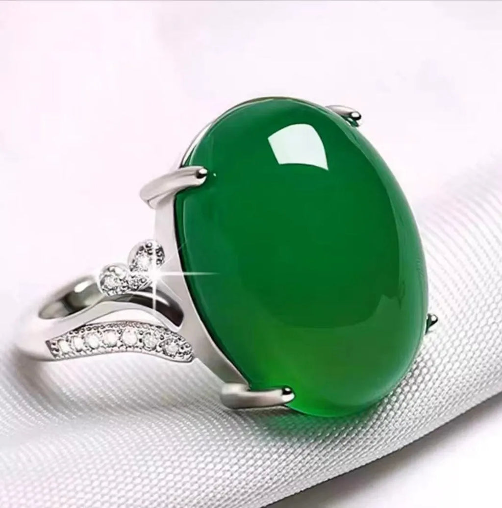 Adjustable geometric alloy ring with ethnic style in blue, shown on a finger.
