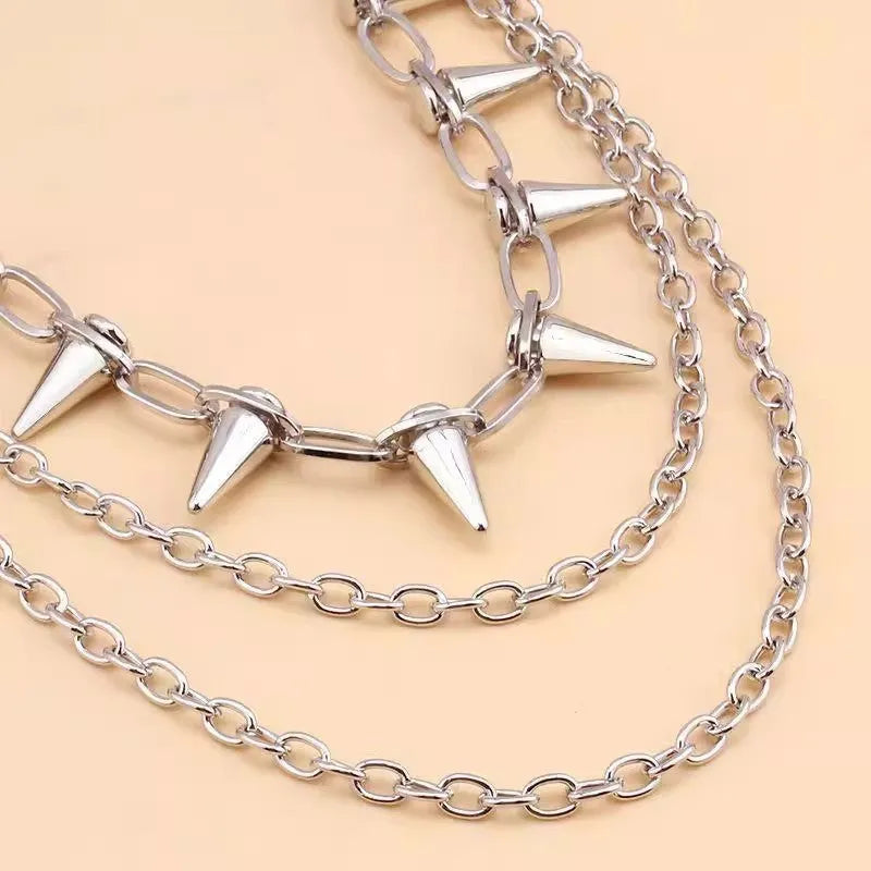 Silver alloy trousers chain with double layer design and rivet detailing, shown against dark fabric