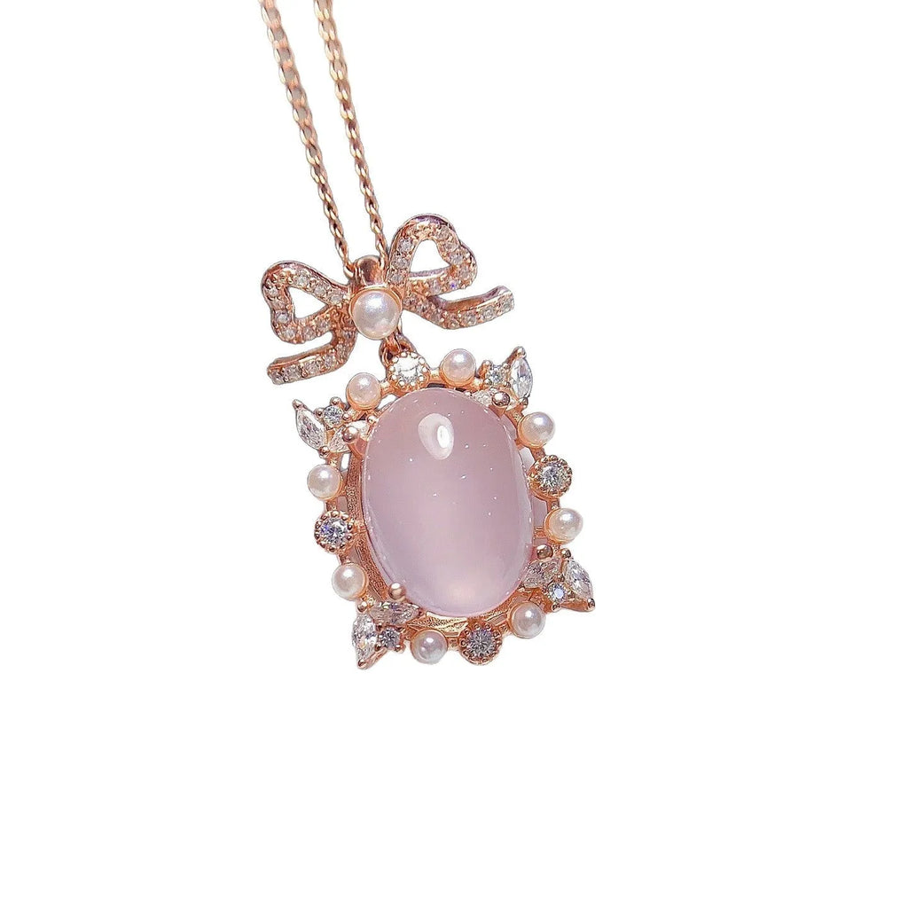 Geometric rose quartz pendant on a rose gold plated silver chain.
