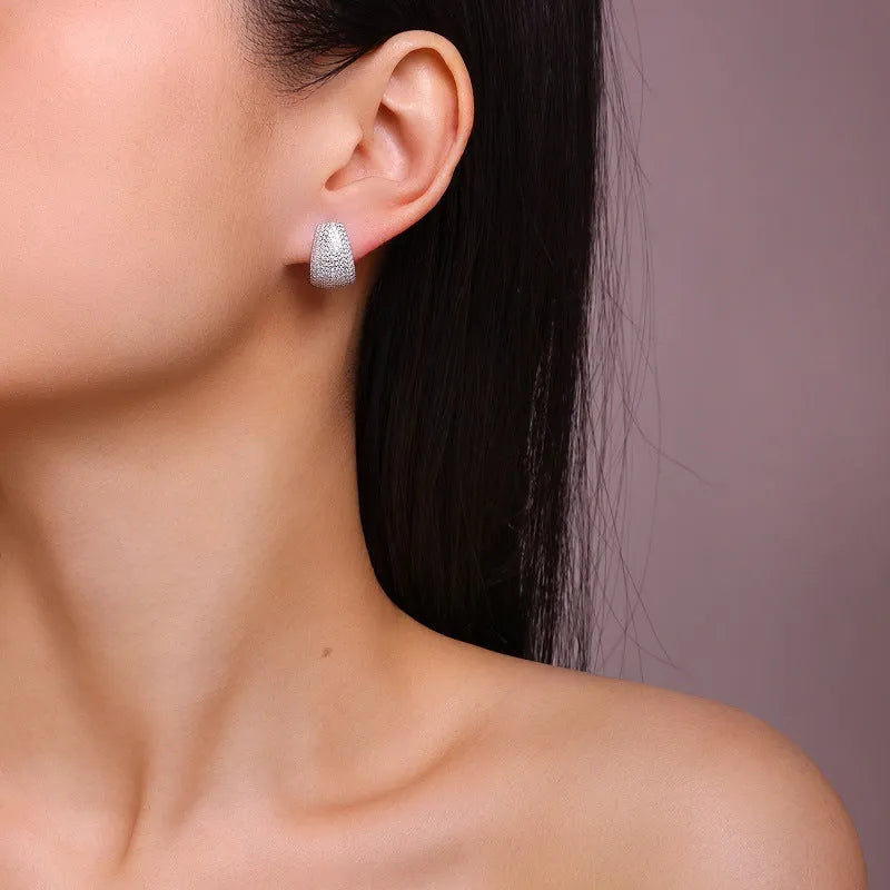 Geometric women's ear studs in sterling silver with moissanite stone accents