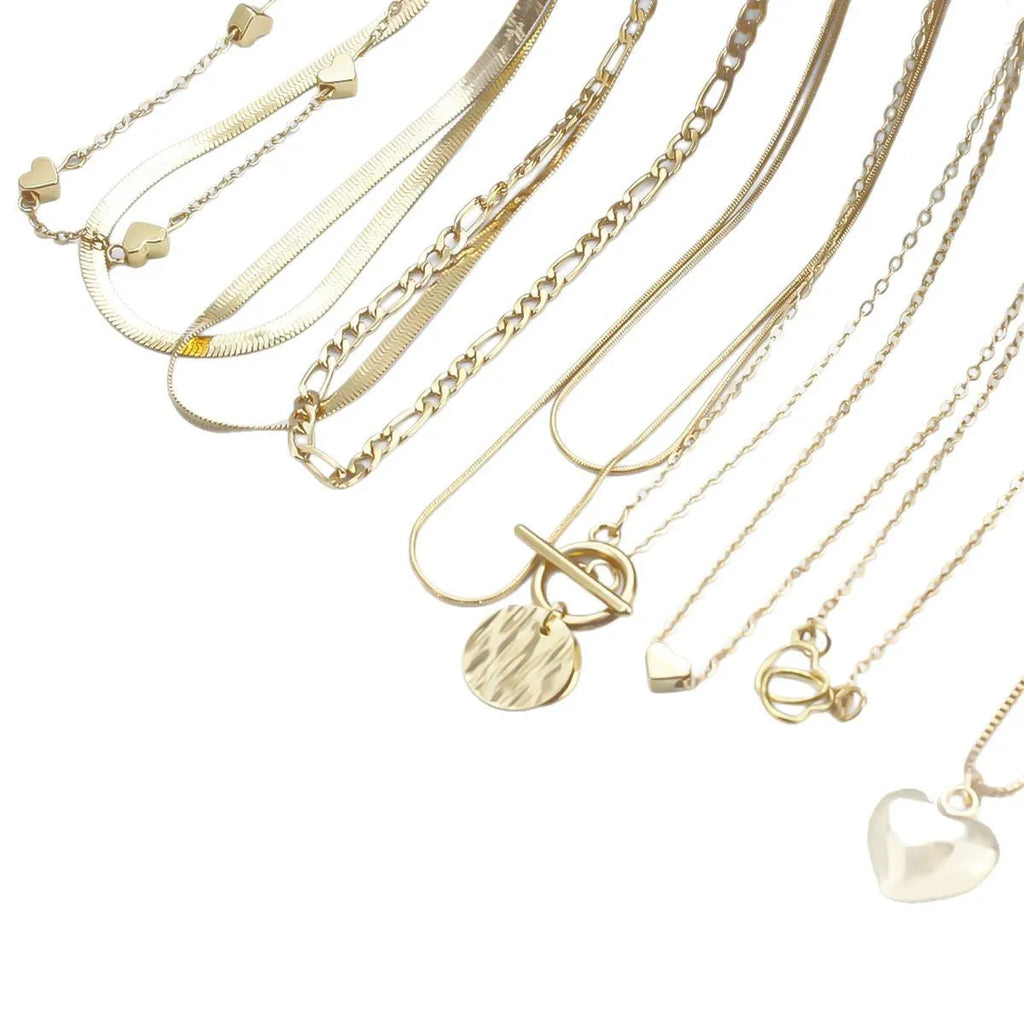 Set of ten gold-coloured women's necklaces with snake bones chains and alloy pendants.