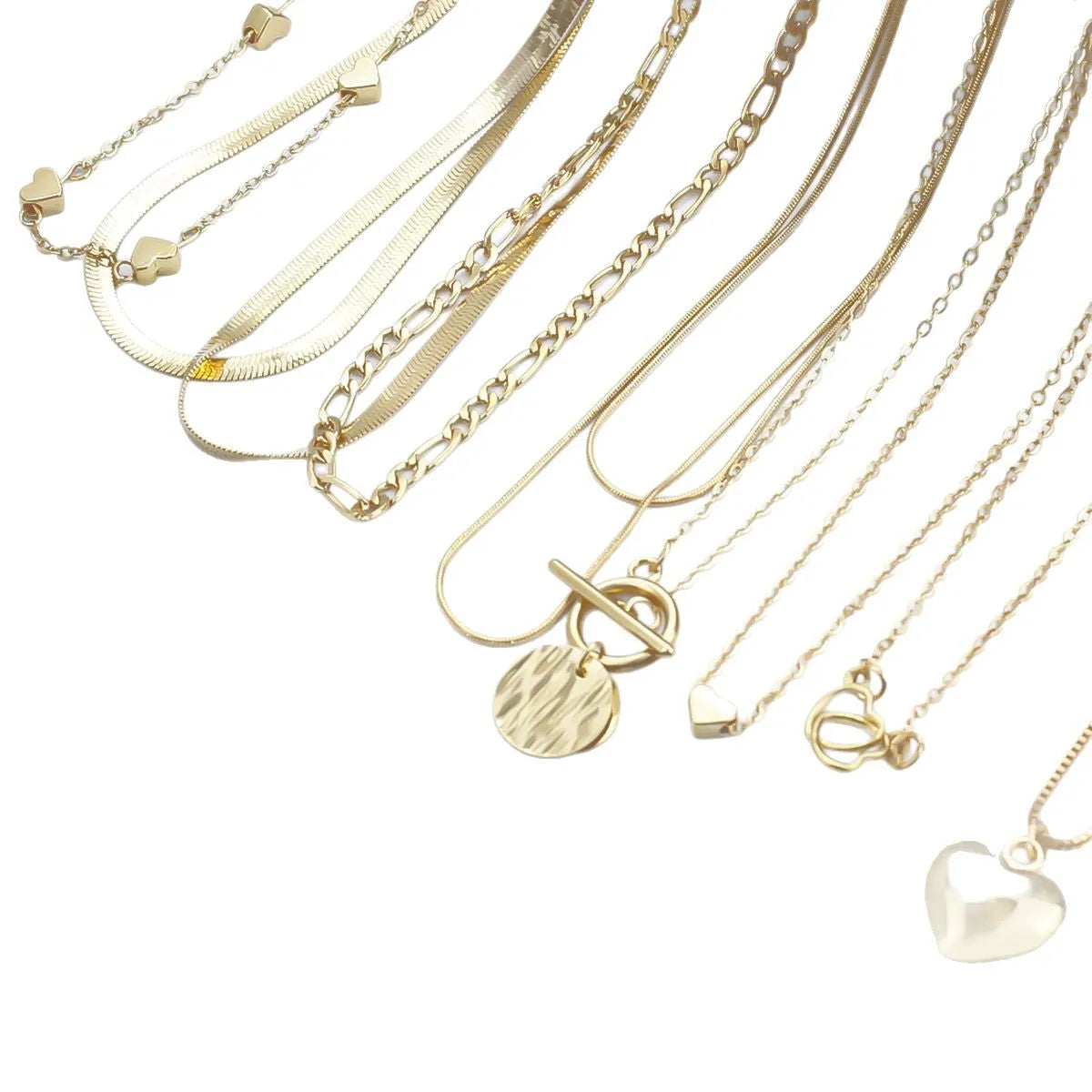 Set of ten gold-coloured women's necklaces with snake bones chains and alloy pendants.