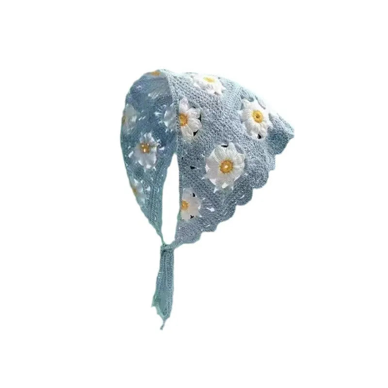 Women's cotton triangle headscarf with floral print in a retro style, shown in a daisy pattern colour.