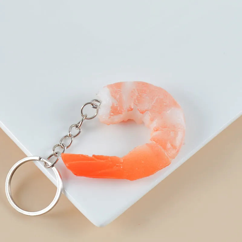 PVC injection moulded shrimp keychain with detailed seafood simulation design and modern simplistic style