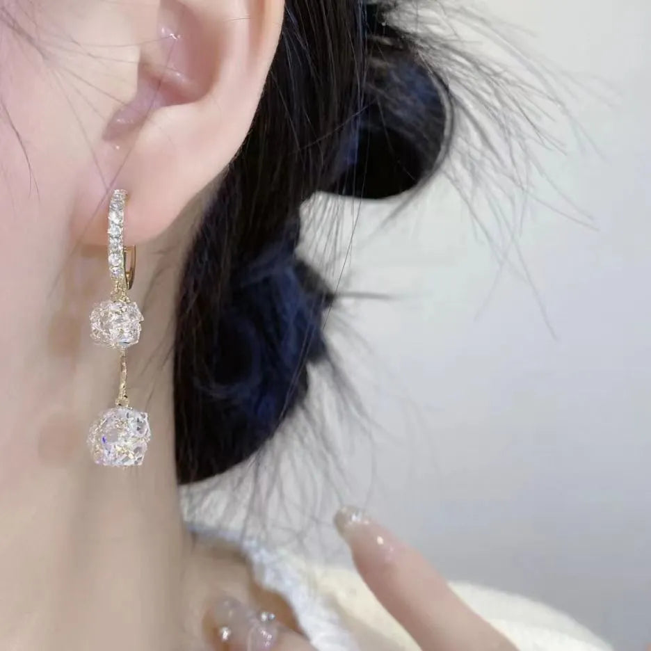 Silver tone rhinestone tassel ball drop earrings with double pendant design