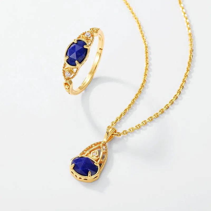 Geometric ellipse silver-colour alloy ring with a central natural lapis lazuli stone.