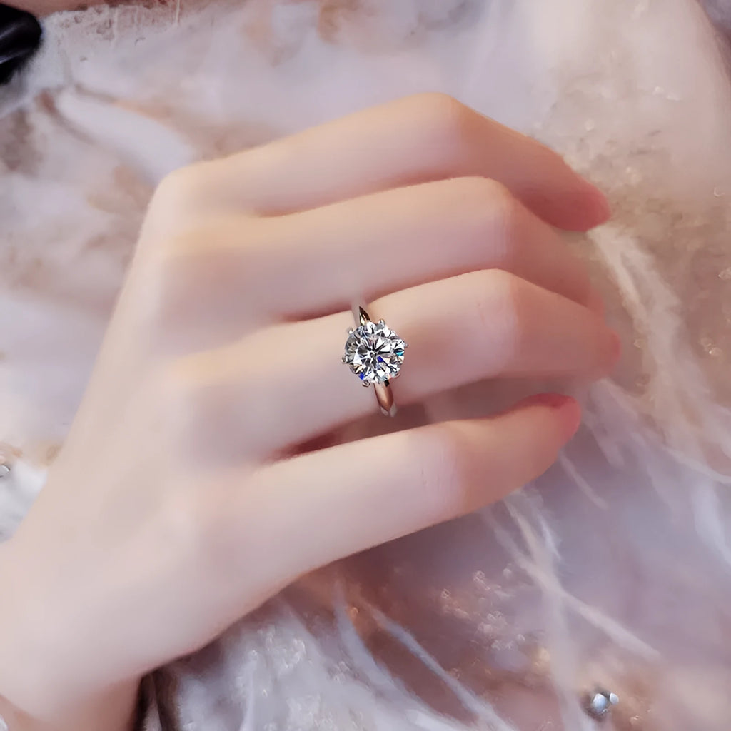 White gold plated geometric ring with a six-claw setting holding a zircon stone