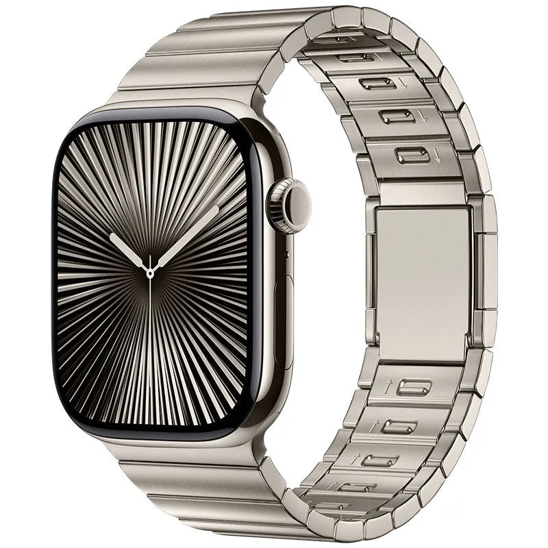 Stainless steel magnetic buckle watch strap for Apple Watch in silver colour on grey background