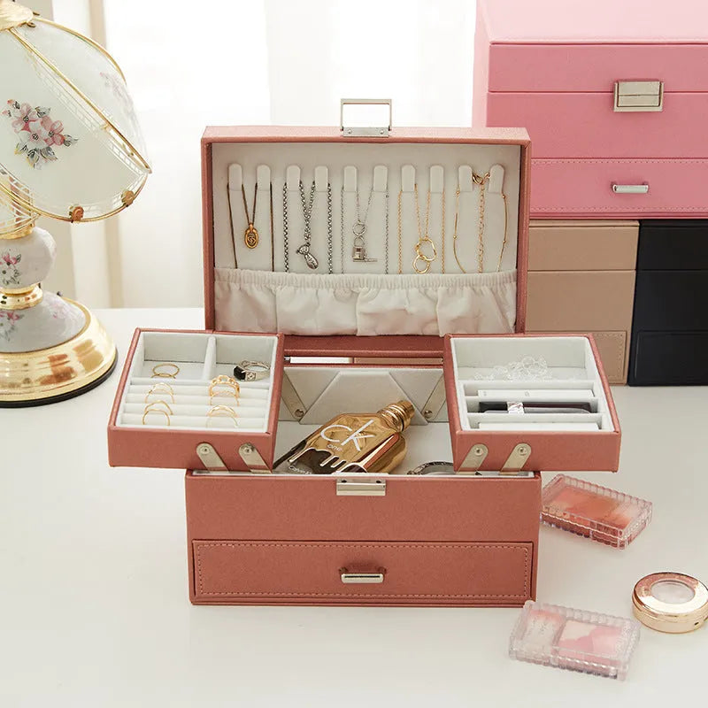 Hard black PU leather jewellery storage box with organised compartments for rings and necklaces.
