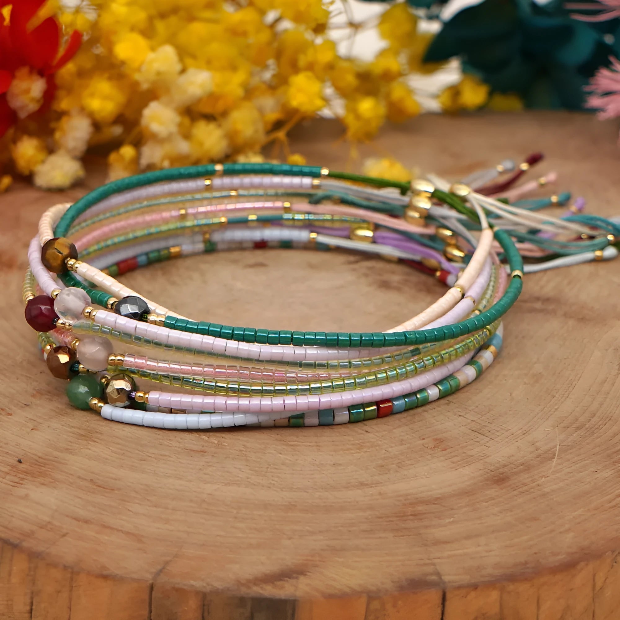 Handmade colourful beaded bracelet with geometric stone and glass beads on a wrist