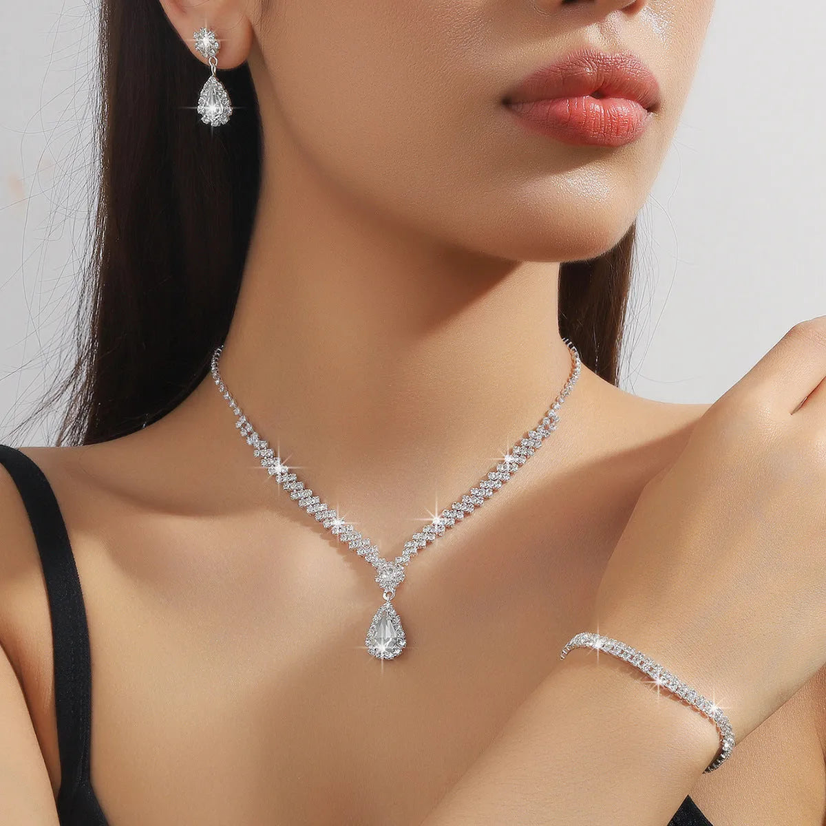 Claw chain necklace and earrings set with water drop rhinestones in multiple colour options