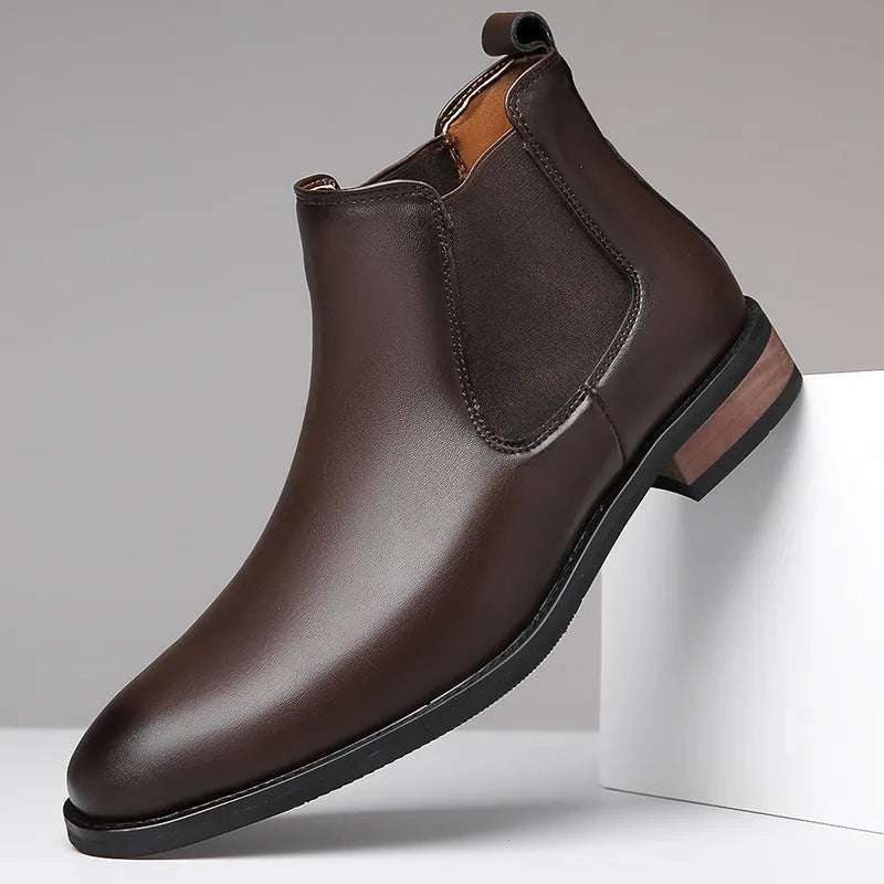 Men's black Chelsea boots with pointed toe design and artificial PU leather construction