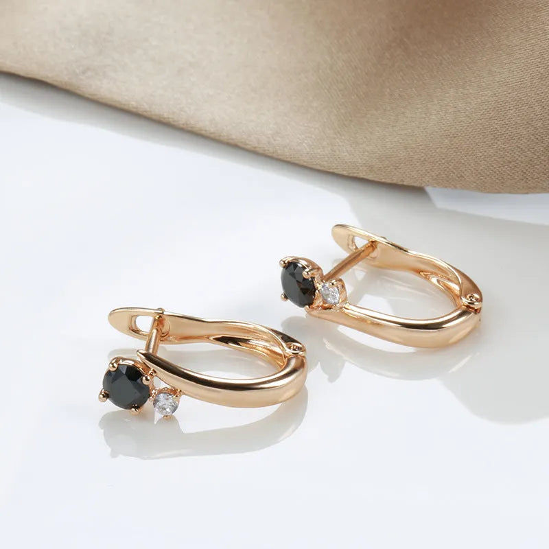 Gold drop earrings with black agate stones in geometric retro design for women