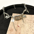 Dark multi-layer cross necklace for women with twin chains and an adjustable 41-50cm length.