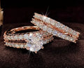Two-ring women's set showing jewelled and geometric designs in silver, gold, and rose gold alloy