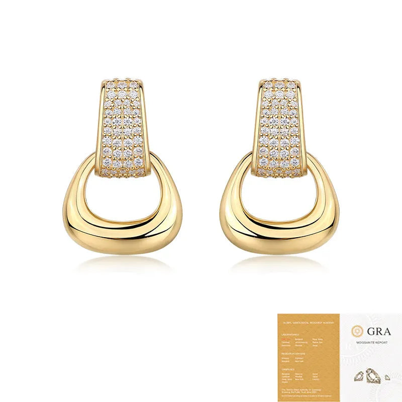 Pair of silver moissanite stud earrings with geometric shape and round popular element