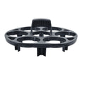 Black plastic egg holder rack for a cooking machine on a kitchen countertop.