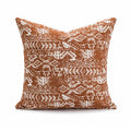 A square coreless decorative sofa cushion with an abstract geometric pattern in red and brown colours.