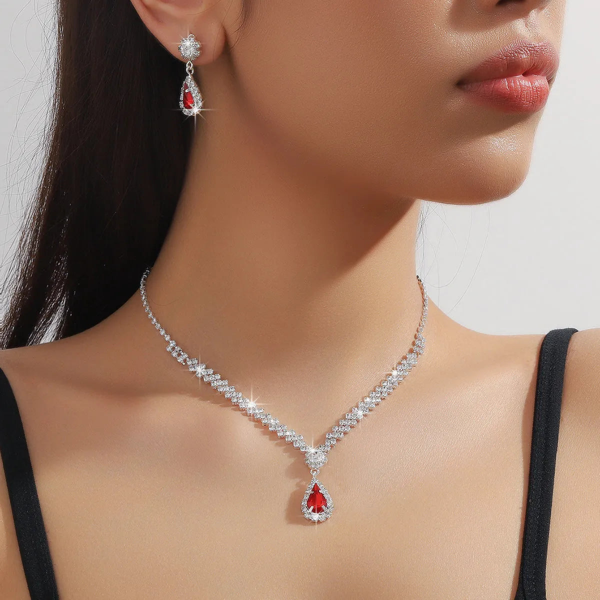 Claw chain necklace and earrings set with water drop rhinestones in multiple colour options
