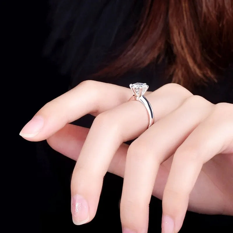 White gold plated geometric ring with a six-claw setting holding a zircon stone