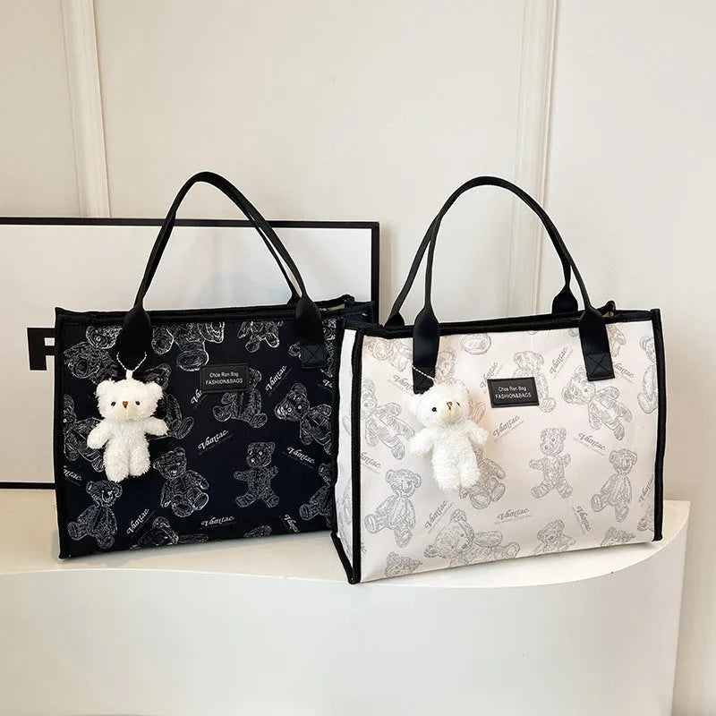 Women's canvas tote bag with diamond pattern design showing black and white colour options