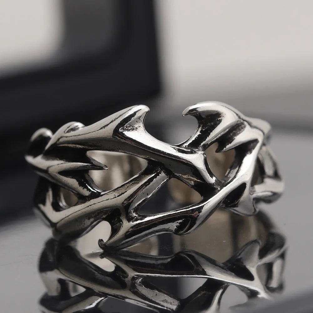 Adjustable copper men's ring with geometric thorn and flower design.