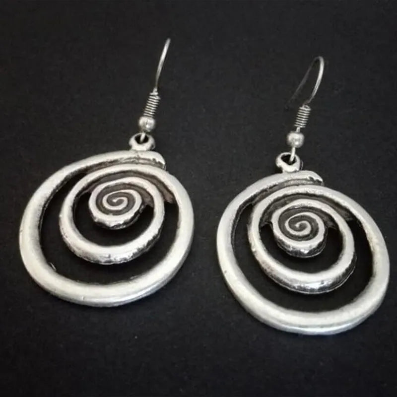 Geometric spiral earrings with distressed silver finish and national style details