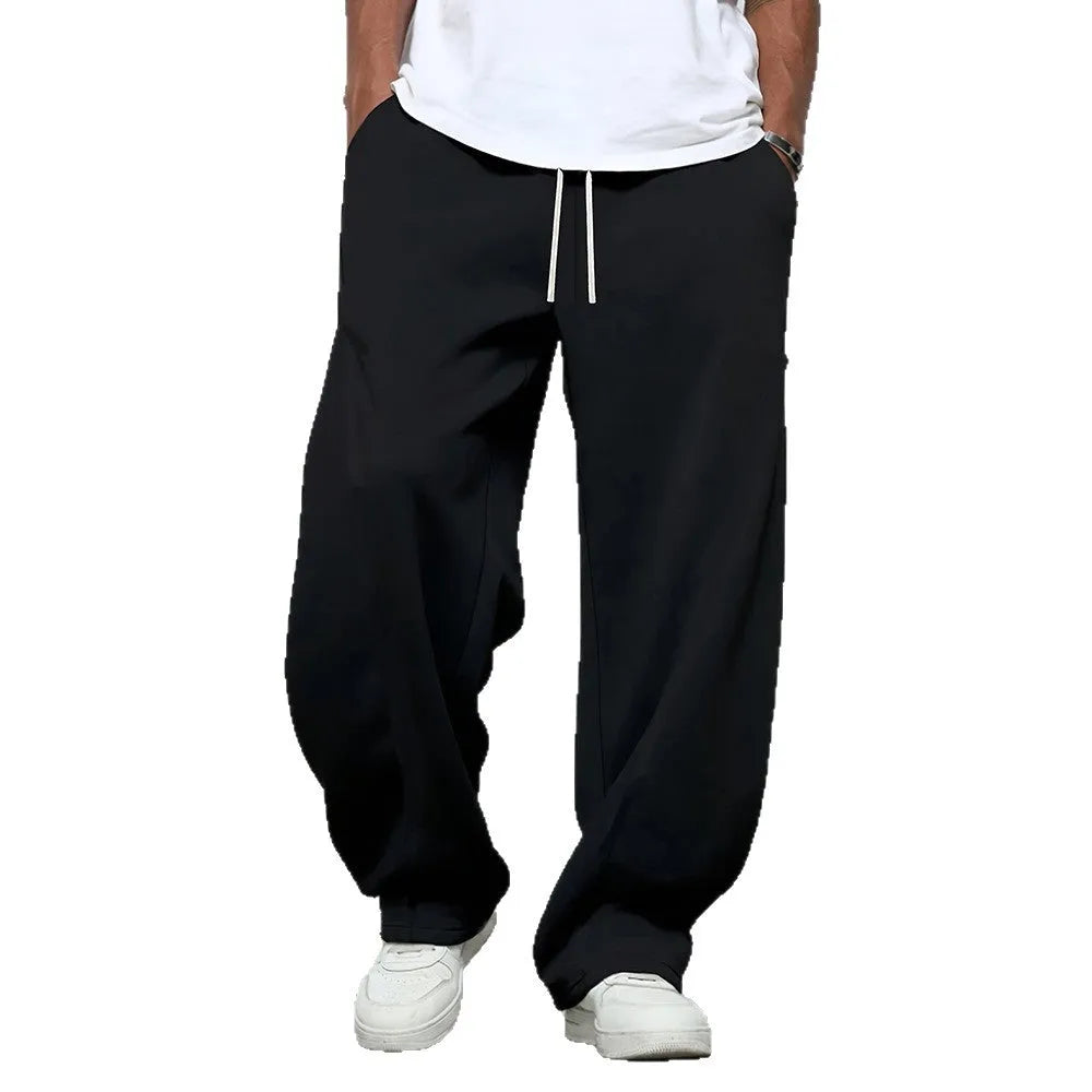 Men's straight leg casual trousers with a drawstring waist in black, dark grey, or light grey.