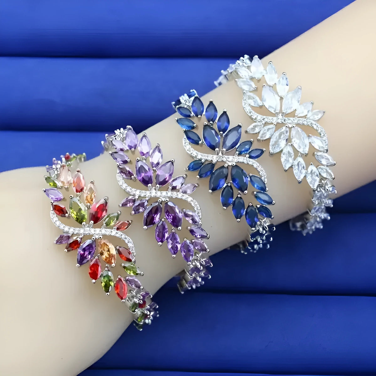 Gold plated copper bracelet with micro inlaid zircon ice flower design in blue, colour, green, purple or white