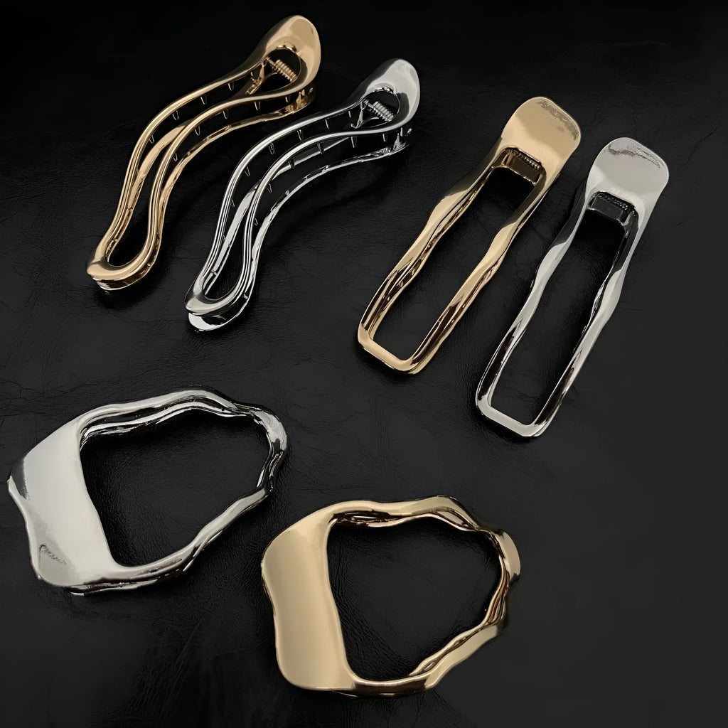 Women's zinc alloy hair barrette in gold or silver with geometric shape options