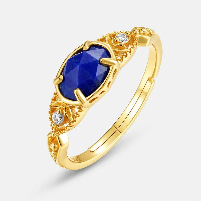 Geometric ellipse silver-colour alloy ring with a central natural lapis lazuli stone.