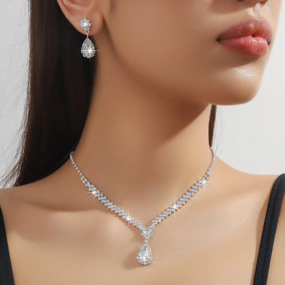 Claw chain necklace and earrings set with water drop rhinestones in multiple colour options