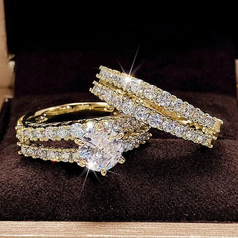 Two-ring women's set showing jewelled and geometric designs in silver, gold, and rose gold alloy