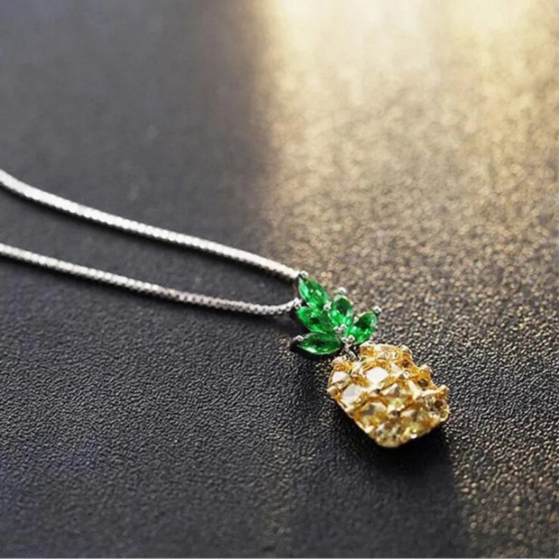Silver-plated geometric pineapple pendant necklace on model