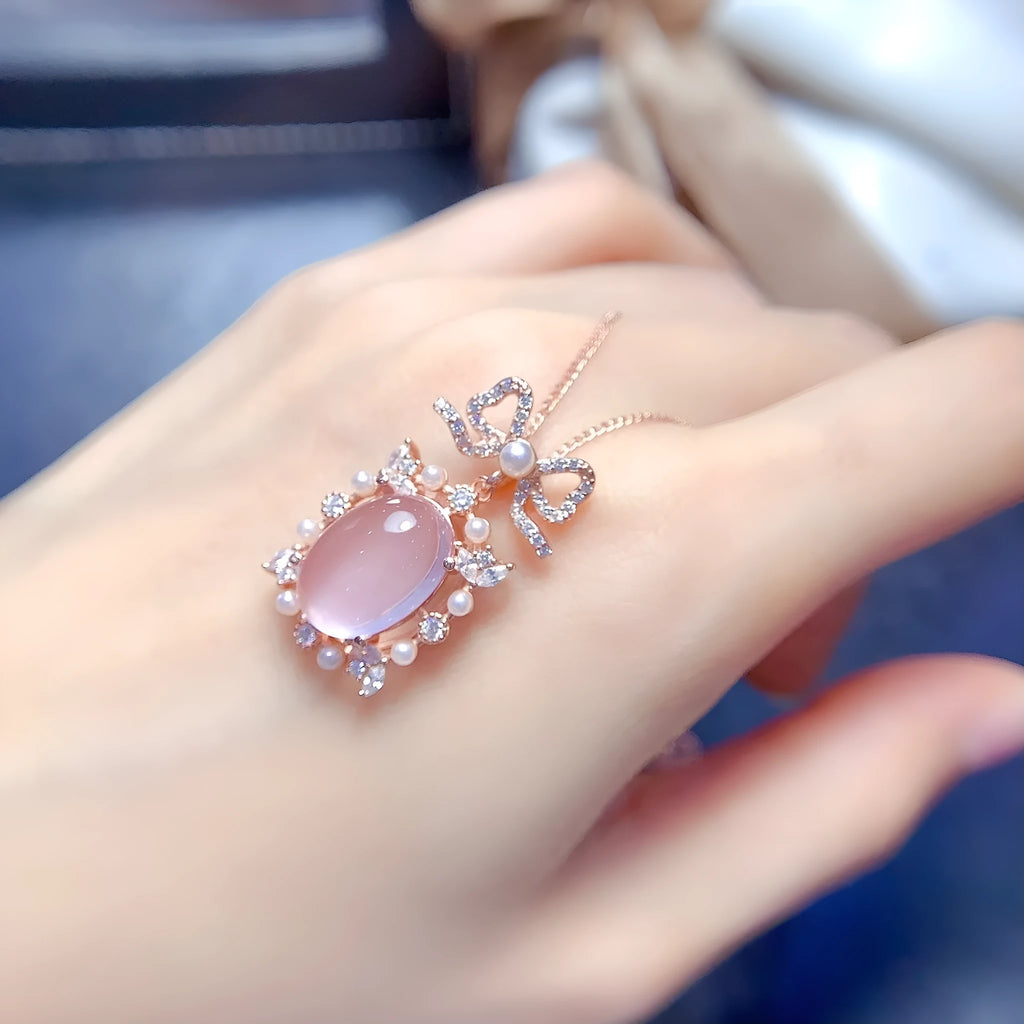 Geometric rose quartz pendant on a rose gold plated silver chain.