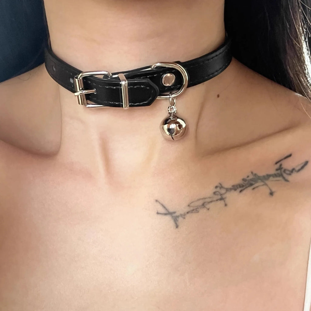 Black adjustable dog collar showing cat paw, bone and LD leather style options with measuring tape showing 21-50cm range