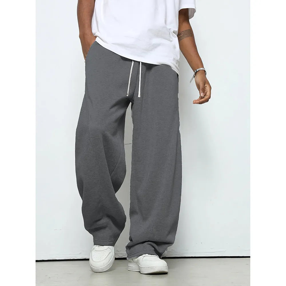 Men's straight leg casual trousers with a drawstring waist in black, dark grey, or light grey.