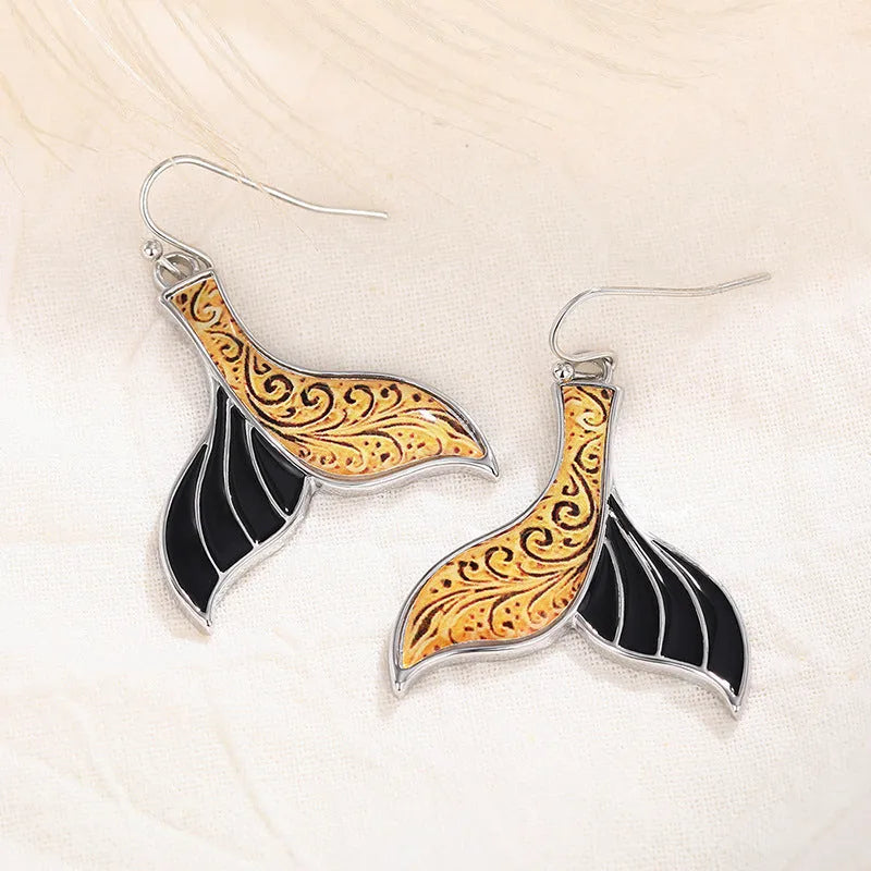 Women's retro fishtail and whale design alloy earrings in white gold colour E4143.