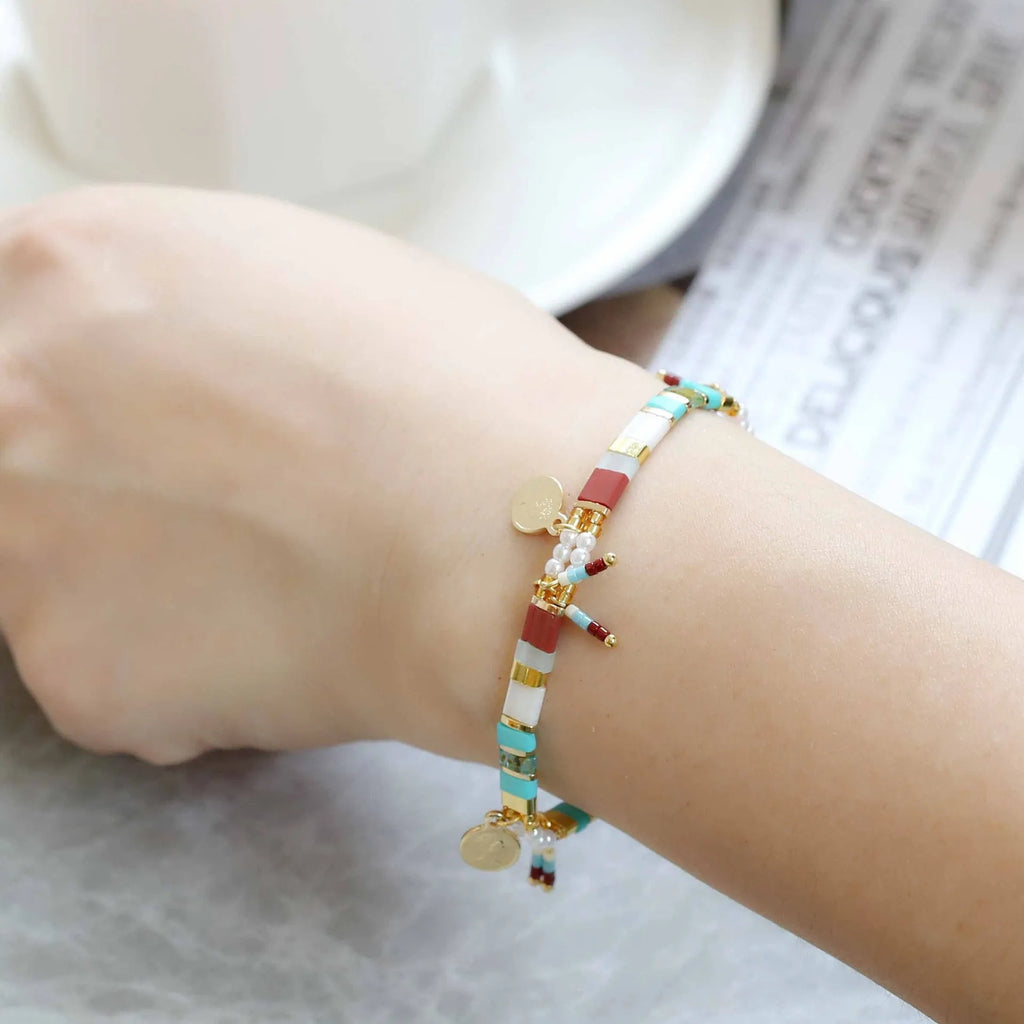 Women's handcrafted imitation pearl beaded bracelet showing European American styling