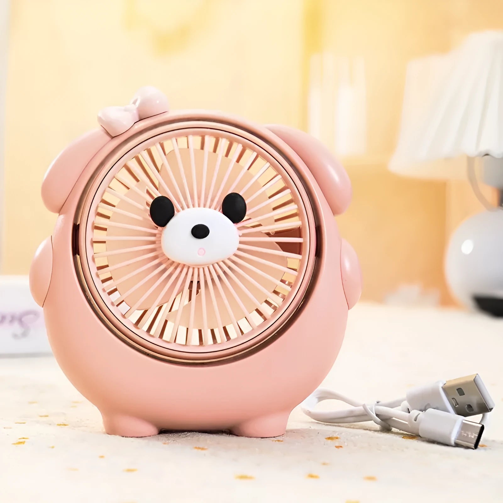 Dog-themed USB desktop electric fan in one of six colour options on a desk.