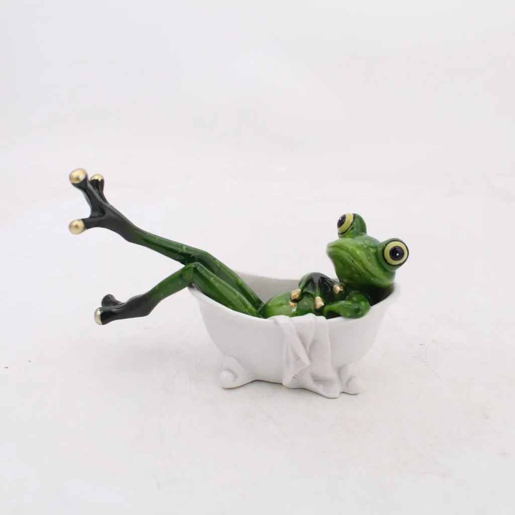 Pastoral style synthetic resin frog ornament for home decoration on a wooden shelf.