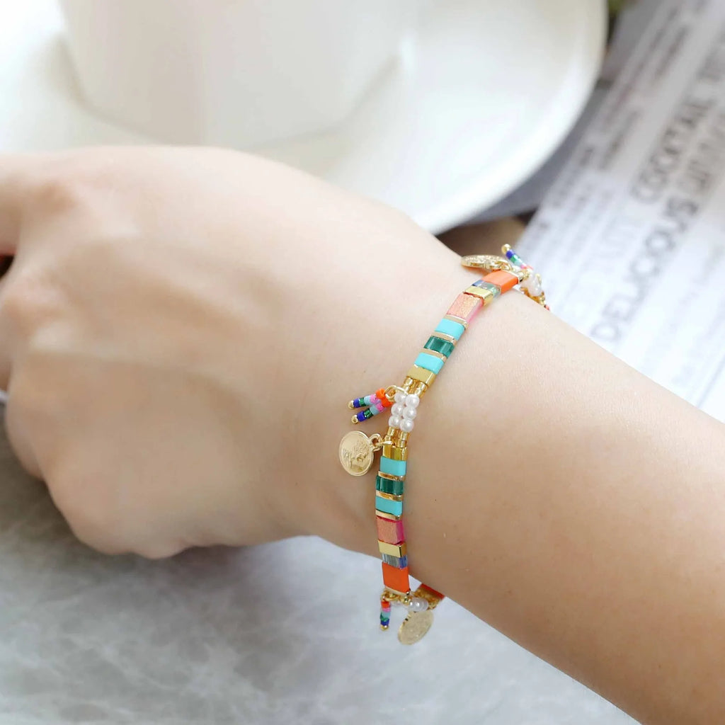 Women's handcrafted imitation pearl beaded bracelet showing European American styling