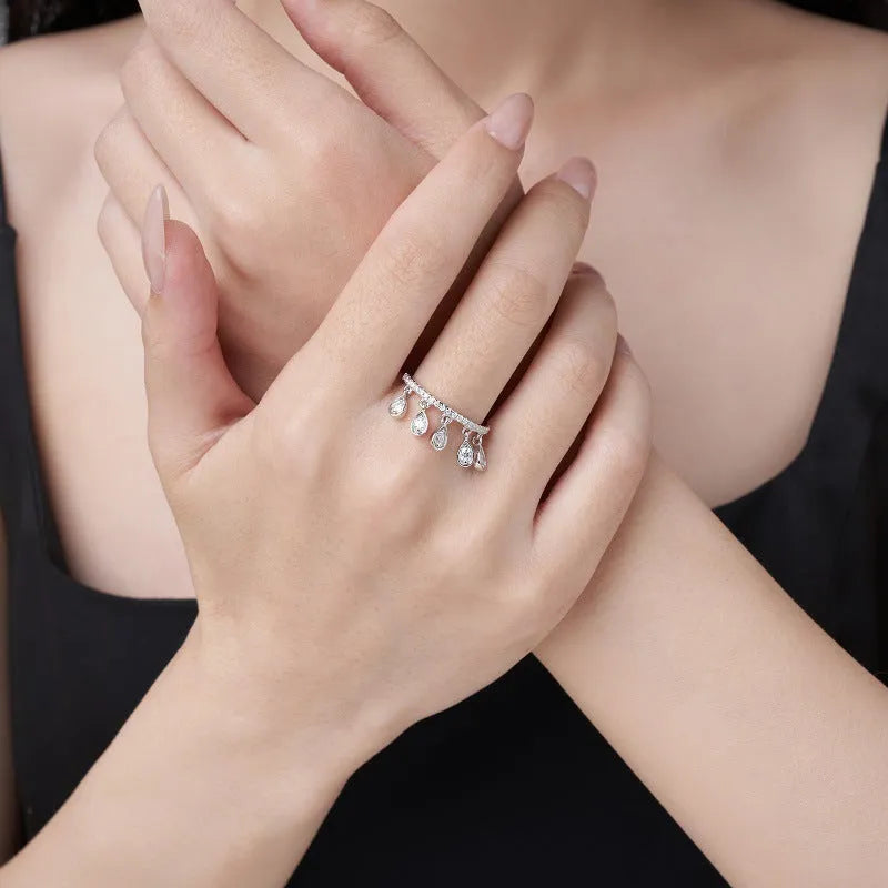 Silver moissanite tassel ring with crown shape, round element, US sizes 5 to 9