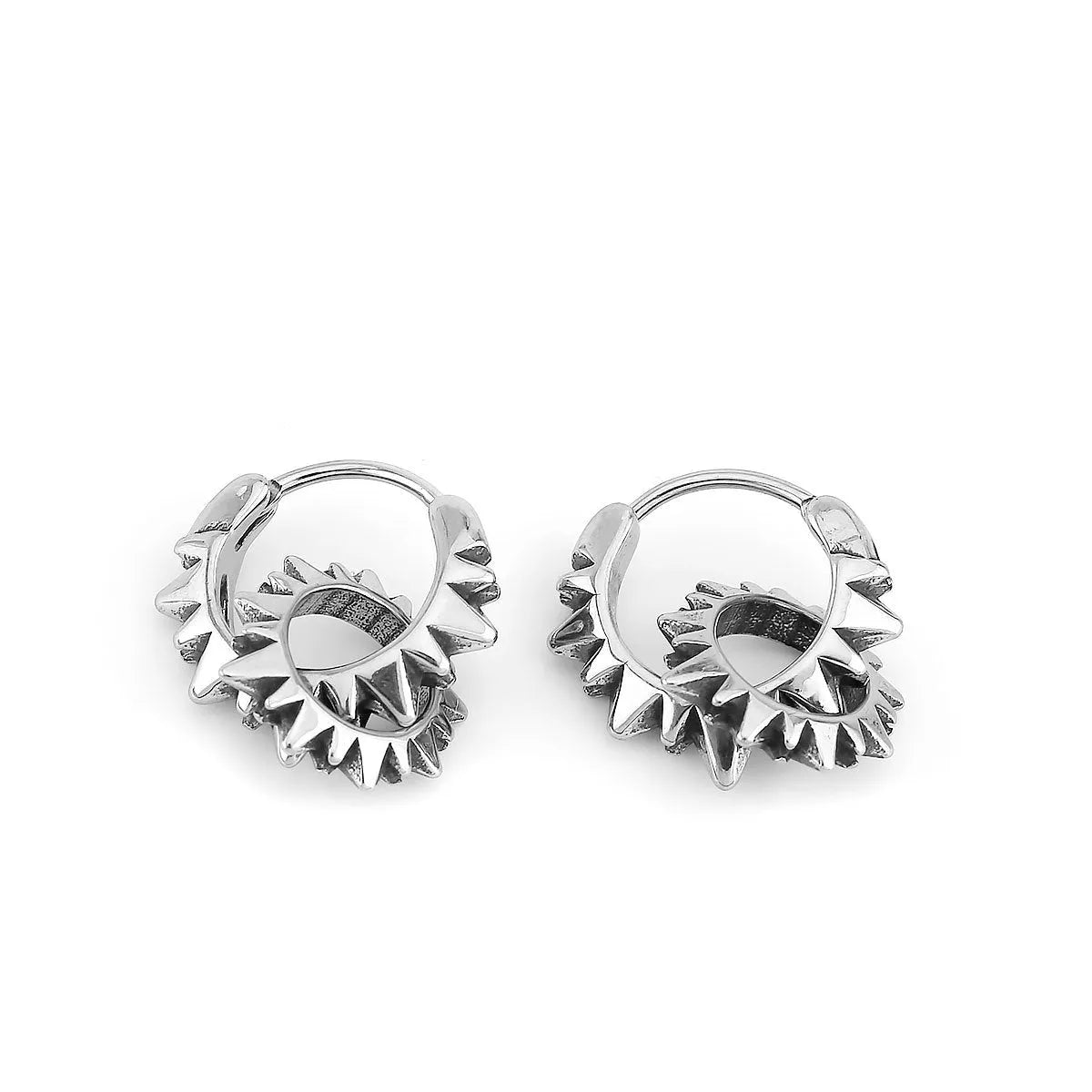 Polished steel round ring earrings with retro styling on stainless steel background