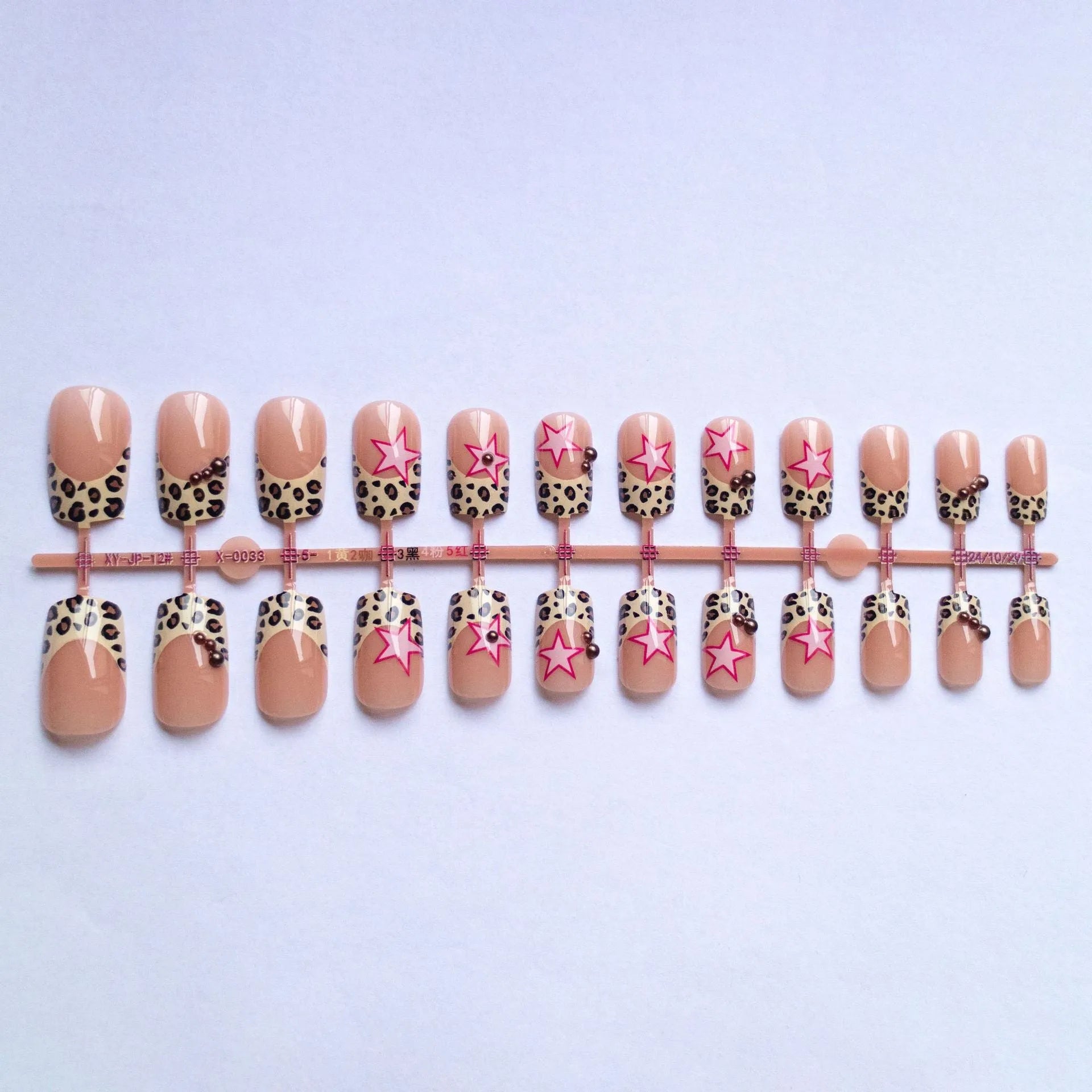 Leopard print French manicure nail art stickers with rhinestone pearls and metallic five-pointed star accessories