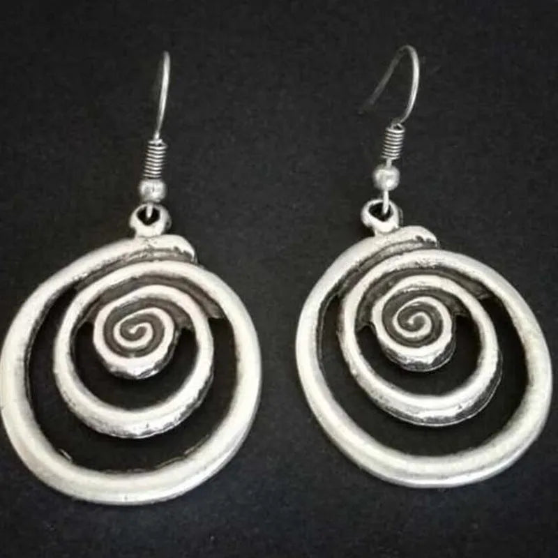 Geometric spiral earrings with distressed silver finish and national style details