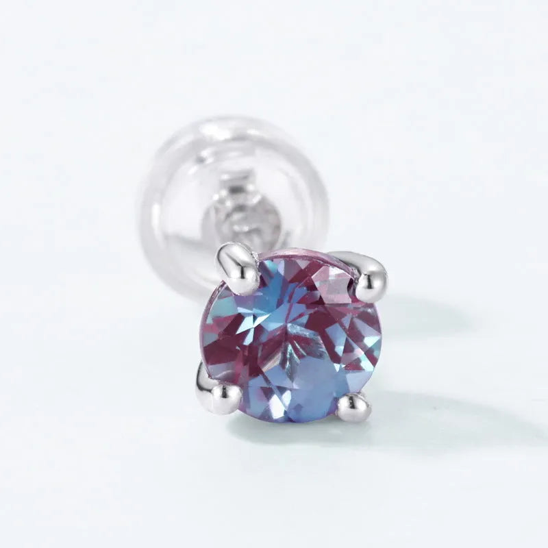 A pair of simple geometric Alexander stone ear studs in 925 silver with a round element, in cultivate Alexandrite colour.