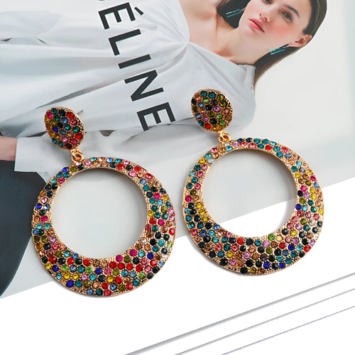 A pair of large round colour alloy pendant earrings with a cartoon style and diamond details for women.
